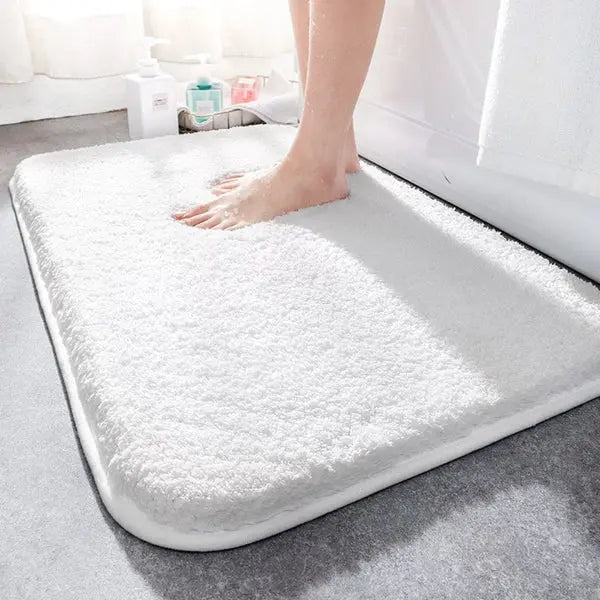 Tapis de bain ultra-absorbants pour salle de bain, confort, séchage rapide et protection contre l’humidité après la douche.