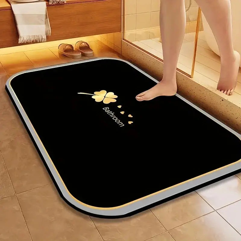 Tapis de bain bonne mousse noir doré