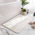 Tapis salle de bain design doré
